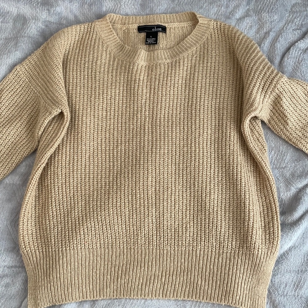 Tan sweater.